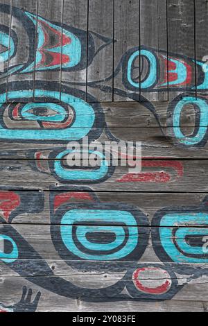 Alaska, Haines. Noow Hit Tribal House, last remaining Tlingit traditional structure constructed in the Chilkat Valley. Colorful exterior wall detail. Stock Photo