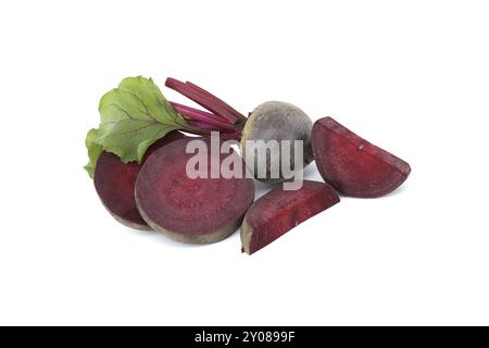 Sliced and whole fresh organic beetroot with green leaves isolated on white background Stock Photo