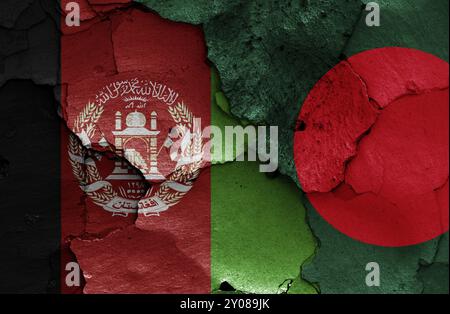 Flags of Afghanistan and Bangladesh painted on cracked wall Stock Photo