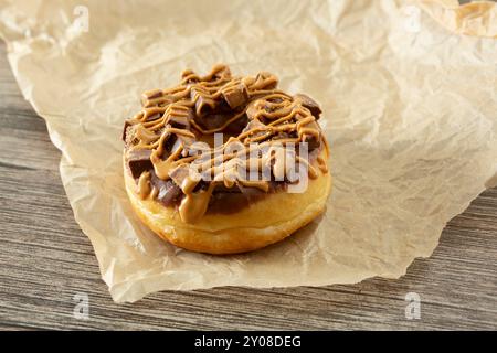 A view of a peanut butter and chocolate wafer bar donut. Stock Photo