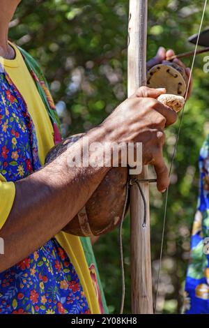 Berimbau player playing his instrument during typical folk festival in the interior of Brazil Stock Photo