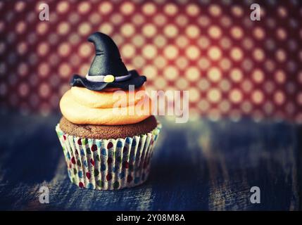 Halloween design homemade cupcake on dark background Stock Photo