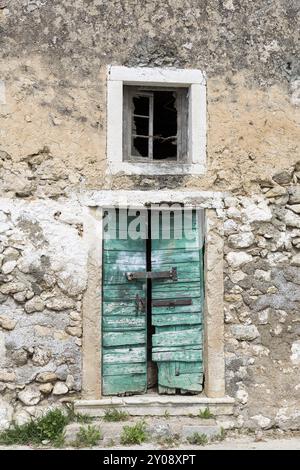 Entrance door of an abandoned house, Greece, Europe Stock Photo