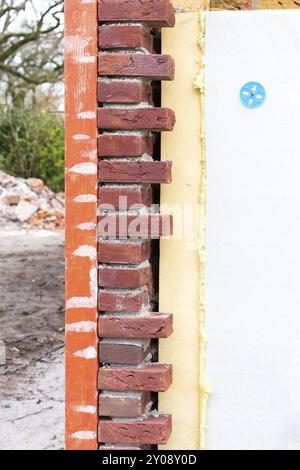 Masonry wall with cavity wall insulation of new house Stock Photo