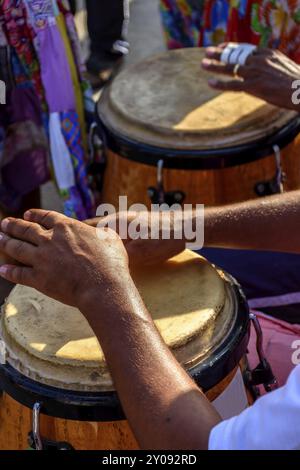 Percussionist playing atabaque during folk samba performance on the streets of Rio de Janeiro Stock Photo