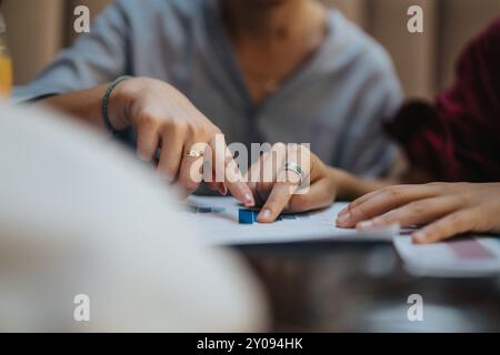 Close-up of businesspeople discussing documents and data at a meeting Stock Photo
