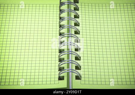 Close up shot of green notebook with focus set in center Stock Photo