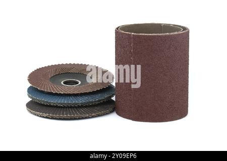 Several sanding discs and sandpaper in close-up view isolated on white background, typically used for grinding, sanding, and polishing in various indu Stock Photo