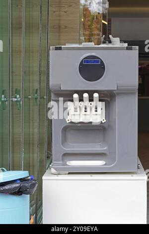 Soft ice cream machine with three flavor Stock Photo