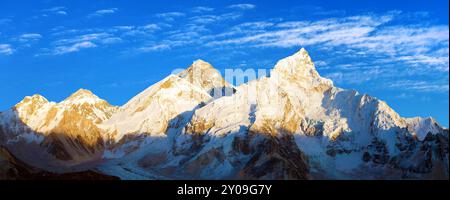 Mount Everest and Nuptse, evening panoramic view with beautiful sunset clouds, Mount Everest seen from Kala Patthar, Sagarmatha national park, Khumbu Stock Photo