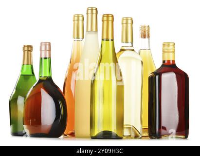 Bottles of assorted alcoholic beverages isolated on white background Stock Photo