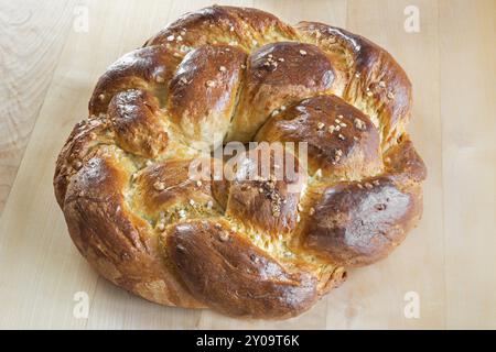 Home-baked yeast plait in the shape of a wreath Stock Photo