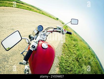 Drivers view of the cockpit in a modern motorcycle on the country road Stock Photo