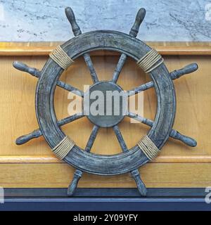 Wooden ship wheel from old vessel Stock Photo