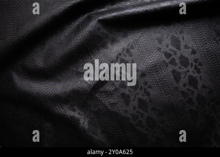 Vegan faux Snakeskin leather texture. minimalist and elegant crumple textile. simple dark black backdrop Stock Photo