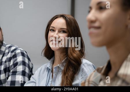 Young creative coworkers working with new startup project in office. Stock Photo