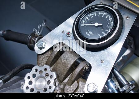 The minimalist cockpit of an older racing motorcycle with a spartan tachometer exudes pure racing and thrill, Germany, Essen, Techno-Classica Stock Photo