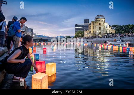 Wpman float lanterns on the river, in front of Atomic Bomb Dome with floating lamps on Motoyasu-gawa River during Peace Memorial Ceremony every August Stock Photo