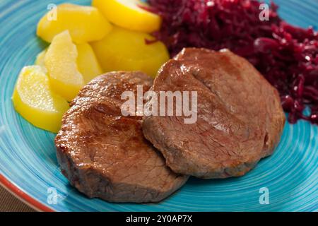 Veal steak with potato and sauerkraut Stock Photo