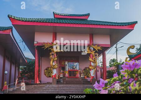 Balikpapan, Indonesia - June 22nd, 2024. the iron gate of Setya Dharma is painted in red and decorated with red lanterns. Stock Photo