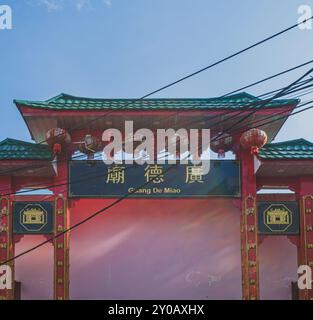 Balikpapan, Indonesia - June 22nd, 2024. the front gate of Setya Dharma is painted in red and decorated with red lanterns. Stock Photo