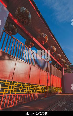 Balikpapan, Indonesia - June 22nd, 2024. the iron gate of Setya Dharma is painted in red and decorated with red lanterns. Stock Photo