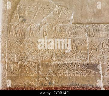 Exquisite wall reliefs of cattle rearing,taming and herding scenes inside the mastaba Tomb of Merurka,Grand Vizier to Pharoah Teti,6th dynasty in Saqqara,Cairo,Egypt Stock Photo