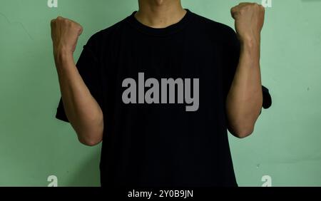 Young confident man pointing to himself isolated on green background Stock Photo