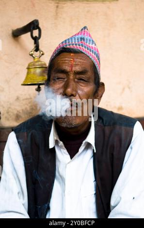 Portrait of a Nepali man wearing a traditional Dhaka Topi hat. Kathmandu, Nepal. Stock Photo