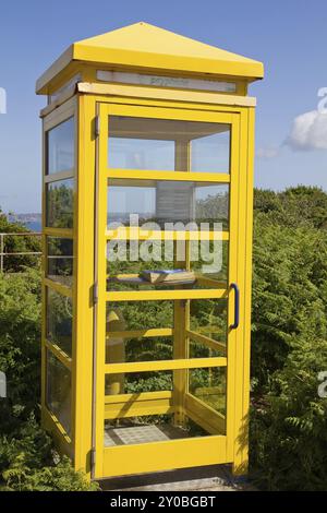 Yellow telephone box on the Channel Island of Jersey (UK) Stock Photo