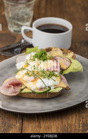 Close-up of eggs Benedict with coffee Stock Photo