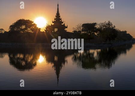 Pagoda silhouette during a sunset in Mandalay, Myanmar (Burma) Stock Photo