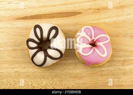 Colorful homemade doughnuts on a wooden board Stock Photo