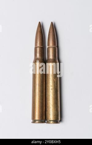 Two rifle bullets on white background Stock Photo