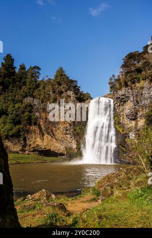 A shot of a waterfall called Hunua falls which is located in Auckland New Zealand. The shot is taken from the bottom of the falls from the side of the Stock Photo