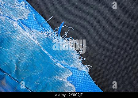 Worn out, obsolete Poly-Tarpaulin blue tarp texture close up Stock Photo