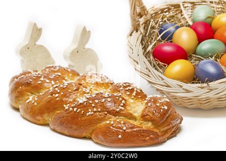 Home-baked yeast plait with Easter eggs and bunnies Stock Photo