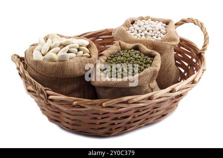 Beans variety, different types of beans in burlap sack and wicker basket, isolated on white Stock Photo