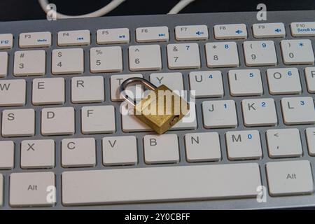 Padlock on a computer keyboard, cybersecurity Stock Photo