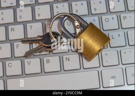 Padlock on a computer keyboard, cybersecurity Stock Photo