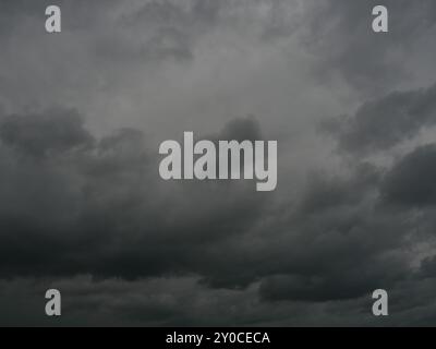 Cumulonimbus cloud formations on tropical sky , Nimbus moving , Abstract background from natural phenomenon and gray clouds hunk , Thailand Stock Photo