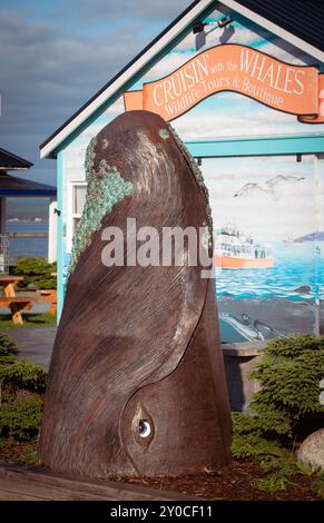 The Breach a large sculpture of the head of a whale by sculptor Ryan Moyes near the Market Wharf on King Street in Saint Andrews, New Brunswick, Canada. Stock Photo