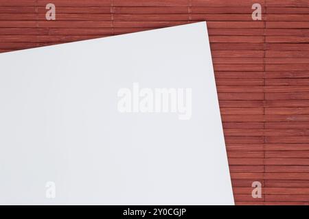 close up of blank sheet of paper on bamboo mat Stock Photo