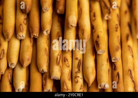 sweet wheat pastries on the table for dessert, Thin and long bread sticks made of wheat flour on the table Stock Photo