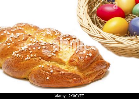 Home-baked yeast plait with colourful Easter eggs Stock Photo