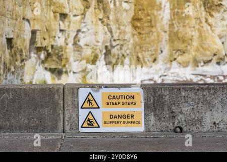 Warning steep steps slippery surface at Friars Bay, Peacehaven, near Brighton, East Sussex, England, UK Stock Photo