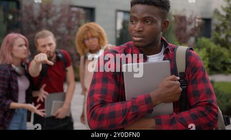 Group of angry students teenagers multiracial classmates mock humiliate ...