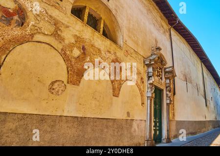 The medieval fresco traces on the facade wall of Santa Grata Church, Via Arena, Citta Alta, Bergamo, Italy Stock Photo