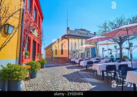 The popular restaurants, cozy outdoor dining and the upper station of Bergamo - San Vigilio funicular, Via al Castello on San Vigilio Hill, Bergamo, L Stock Photo