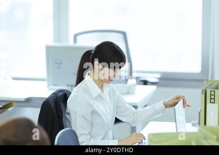 A businesswoman doing deskwork Stock Photo